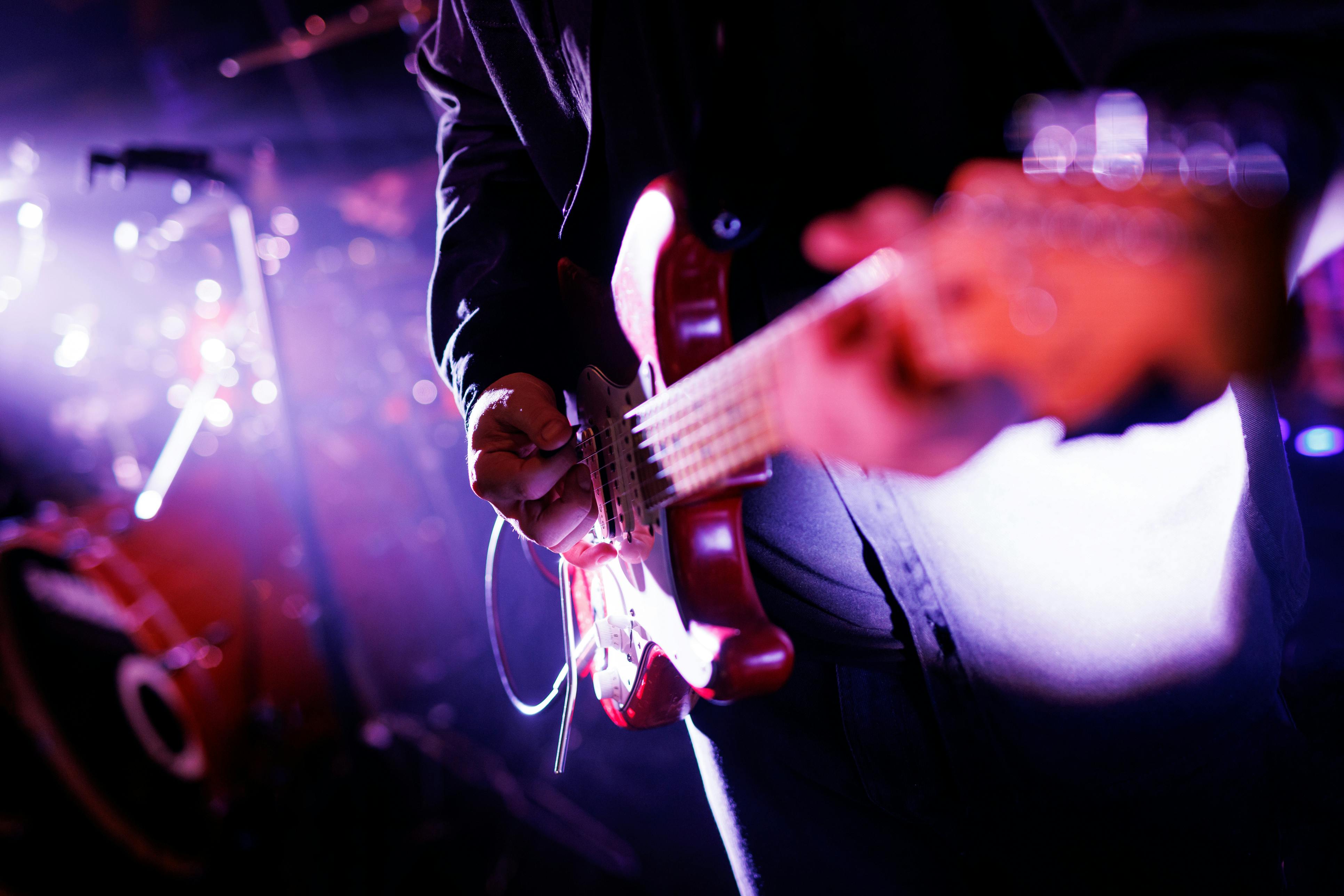 Person playing guitar