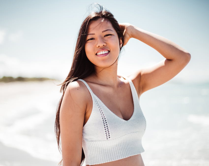Woman at the beach smiling