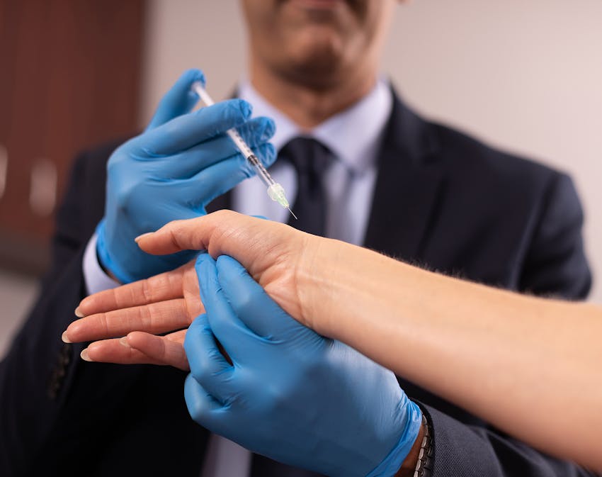 Doctor administering treatment