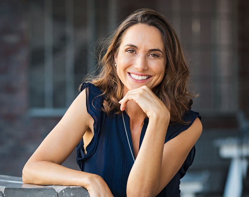 Woman at table smiling