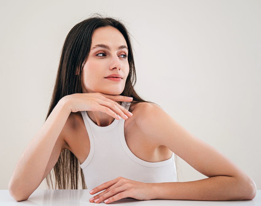 Woman in white at desk