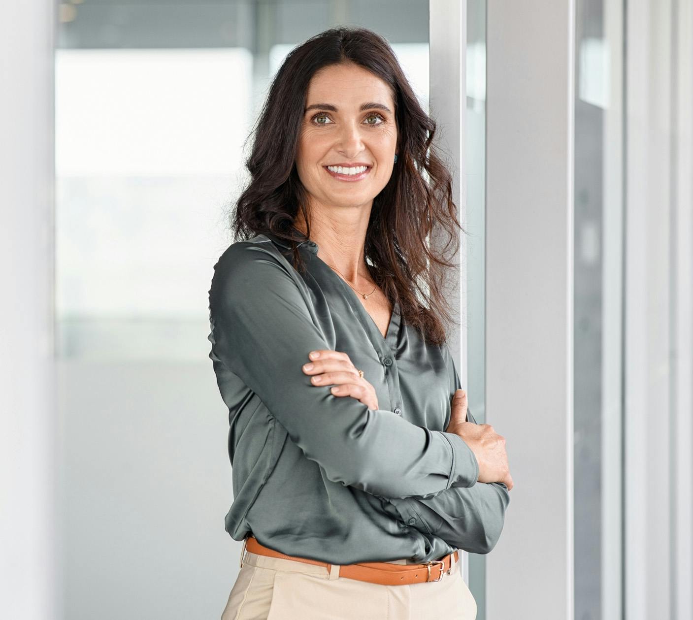 Woman in office smiling at camera