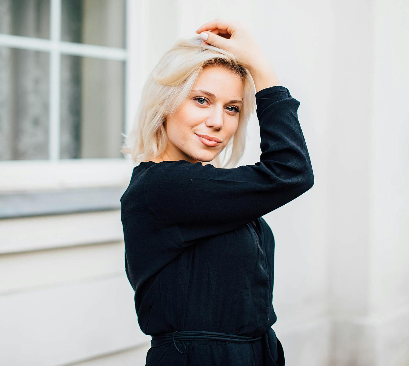 Woman next to window outside
