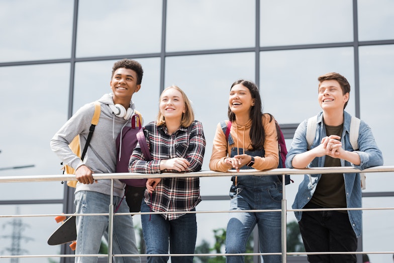 Mixed high school group looking from a balcony