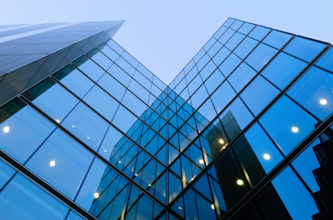 Upward view of a tall glass building in London
