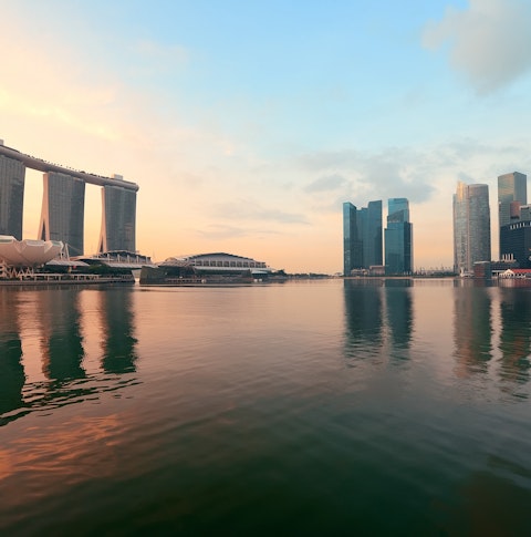 Singapore skyline with urban buildings over water including Marina Bay Sands