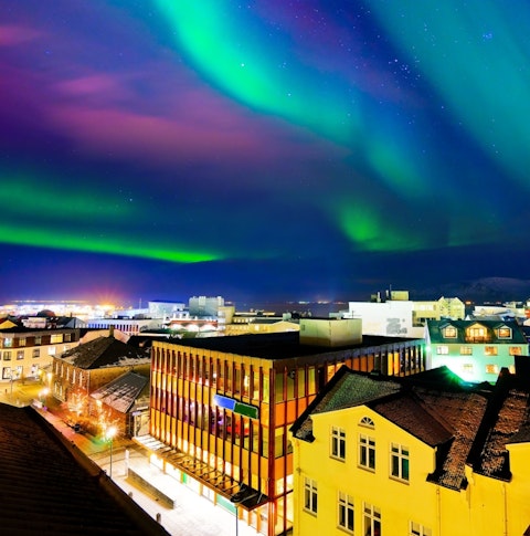 View of northern lights in Reykjavik at night