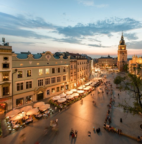 Birds eye view of a busy street in Krakow at night
