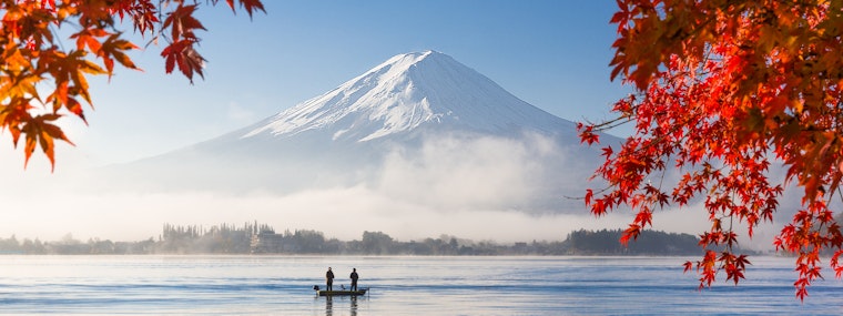 A misty view of Mount Fuji from across a lake in Tokyo, Japan