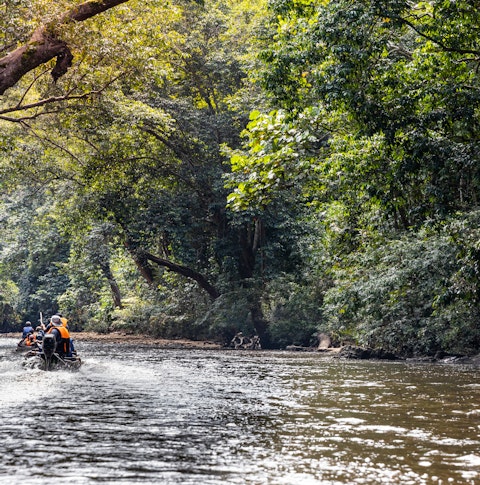 Boats cruising down a river, Malaysia