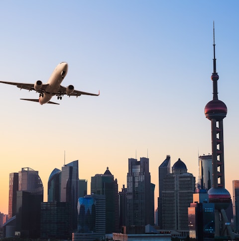 A plane fly's over Shanghai, China