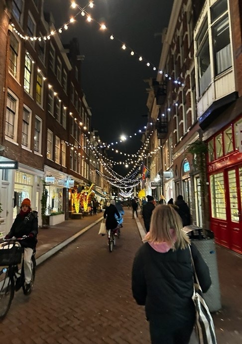 Kadie walking down an Amsterdam street at night