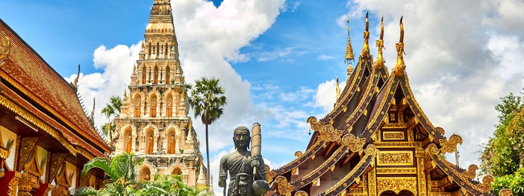 standing statue and temples landmark during daytime