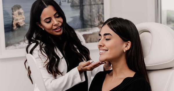 Doctor studying womans face during consultation