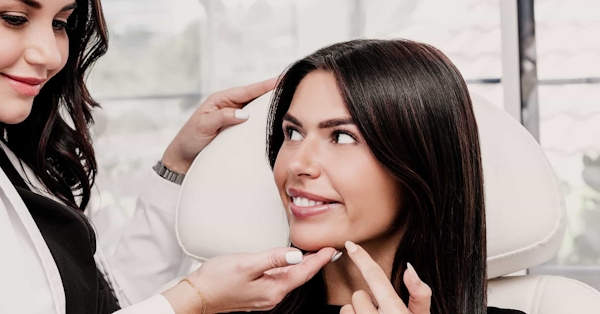 Doctor touching patients face
