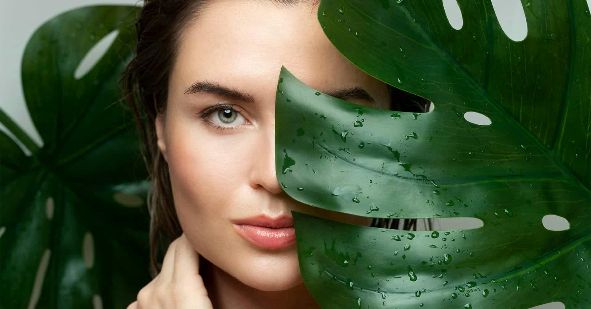 Woman behind leaves