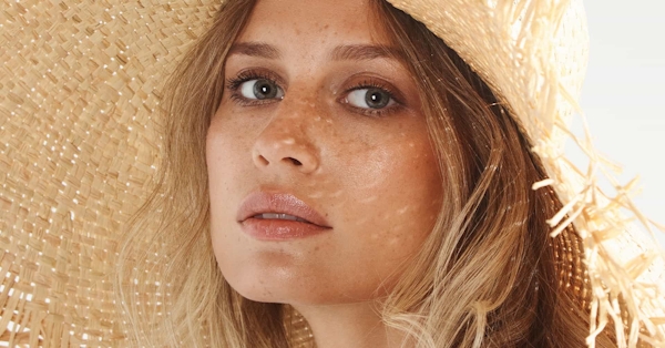 Close up of woman wearing hat