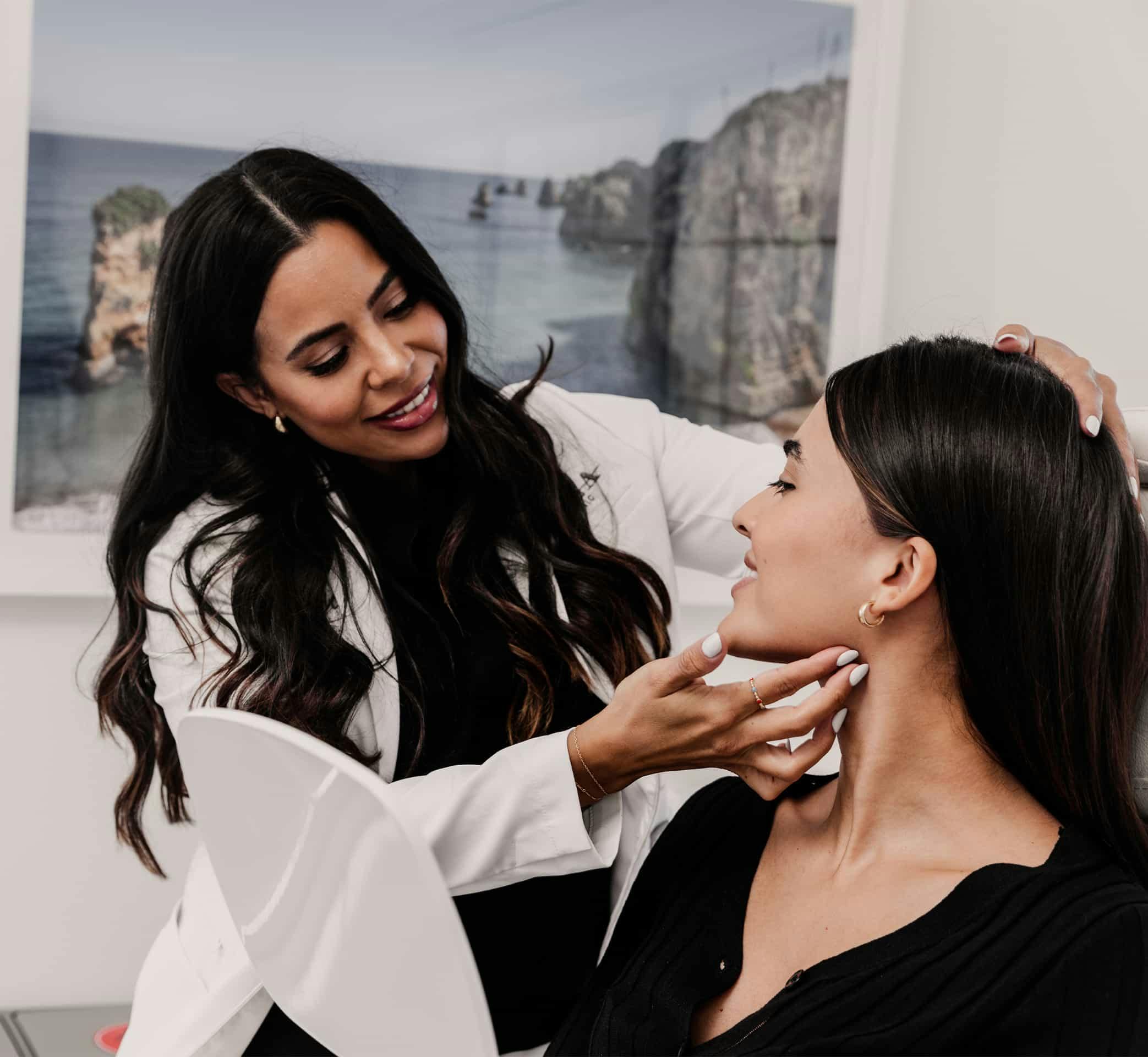 Doctor touching patients face