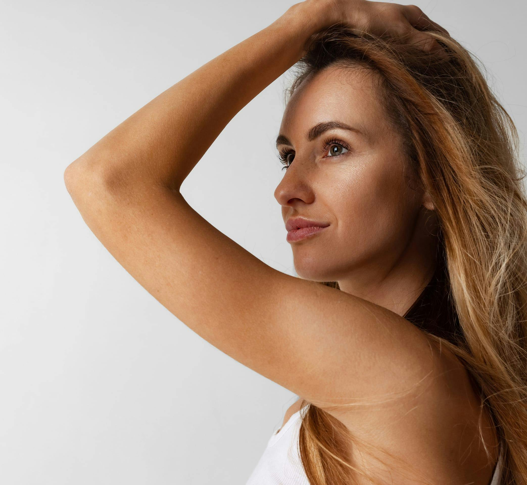 woman touching her hair