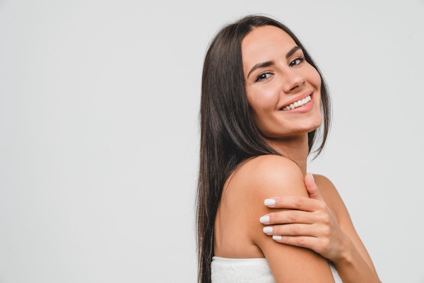 Woman smiling over her shoulder