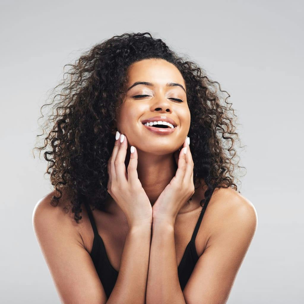Woman with curly hair smiling