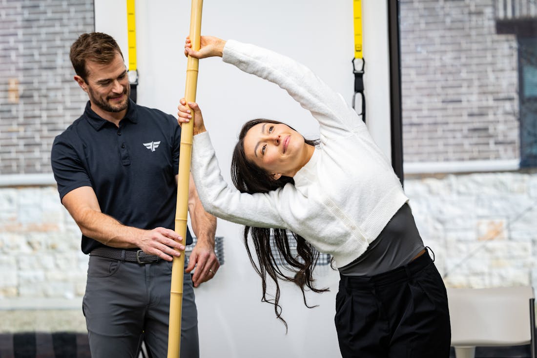 woman and chiropractor doing physical therapy