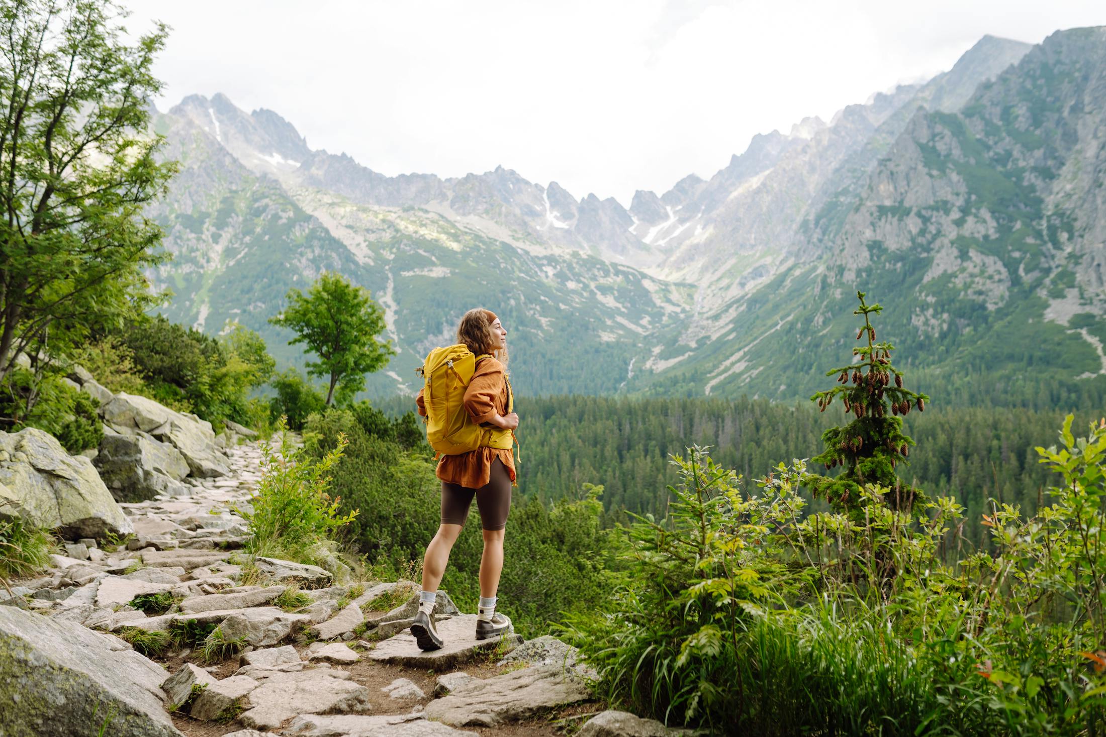 Woman hiking the most beautiful Mountain trail.