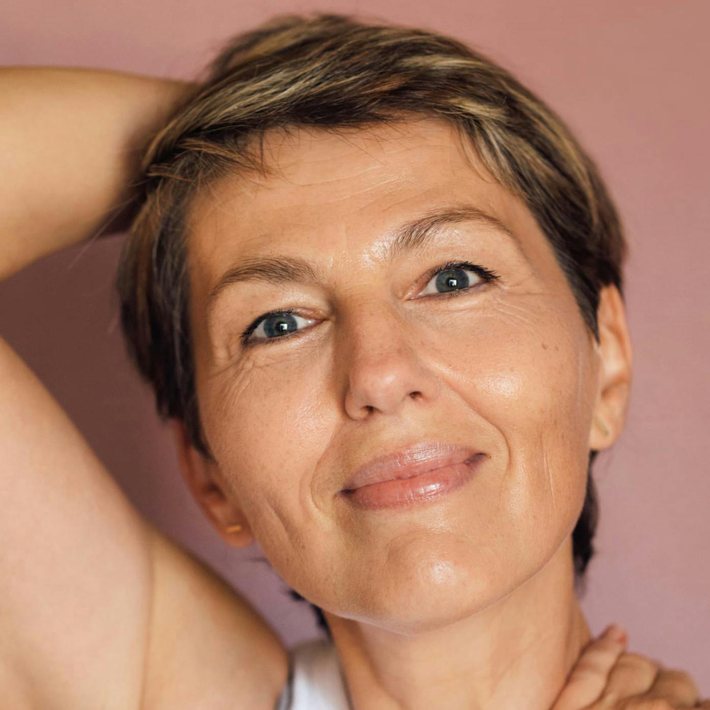 Woman with her hand on her head