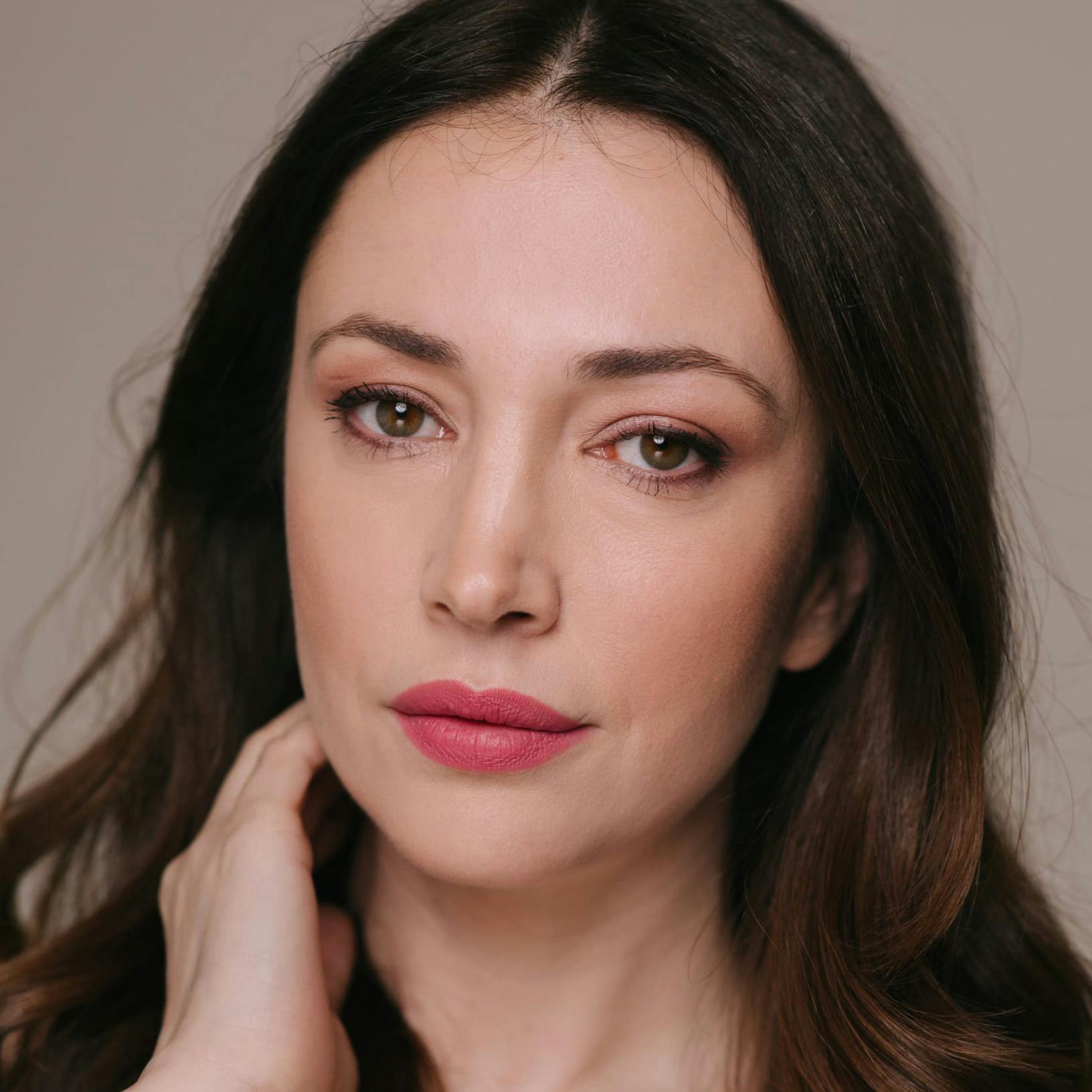 Woman with her hand on her cheek