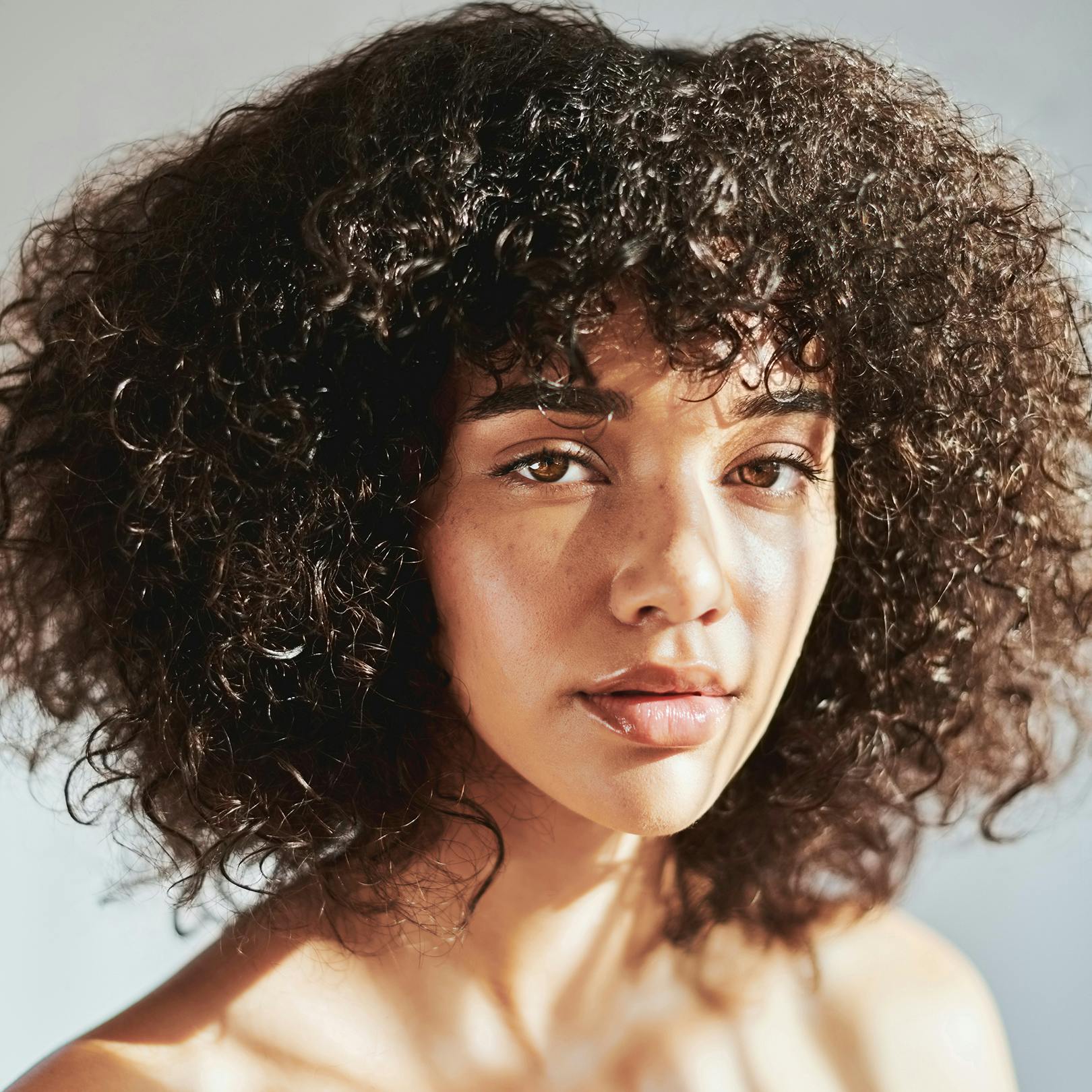 sun light hitting lady as she poses