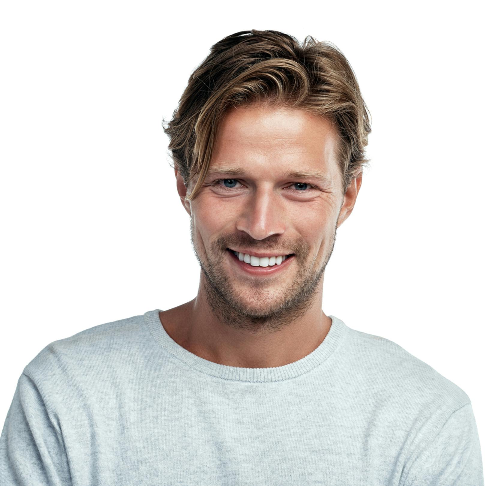 man smiling in gray sweater