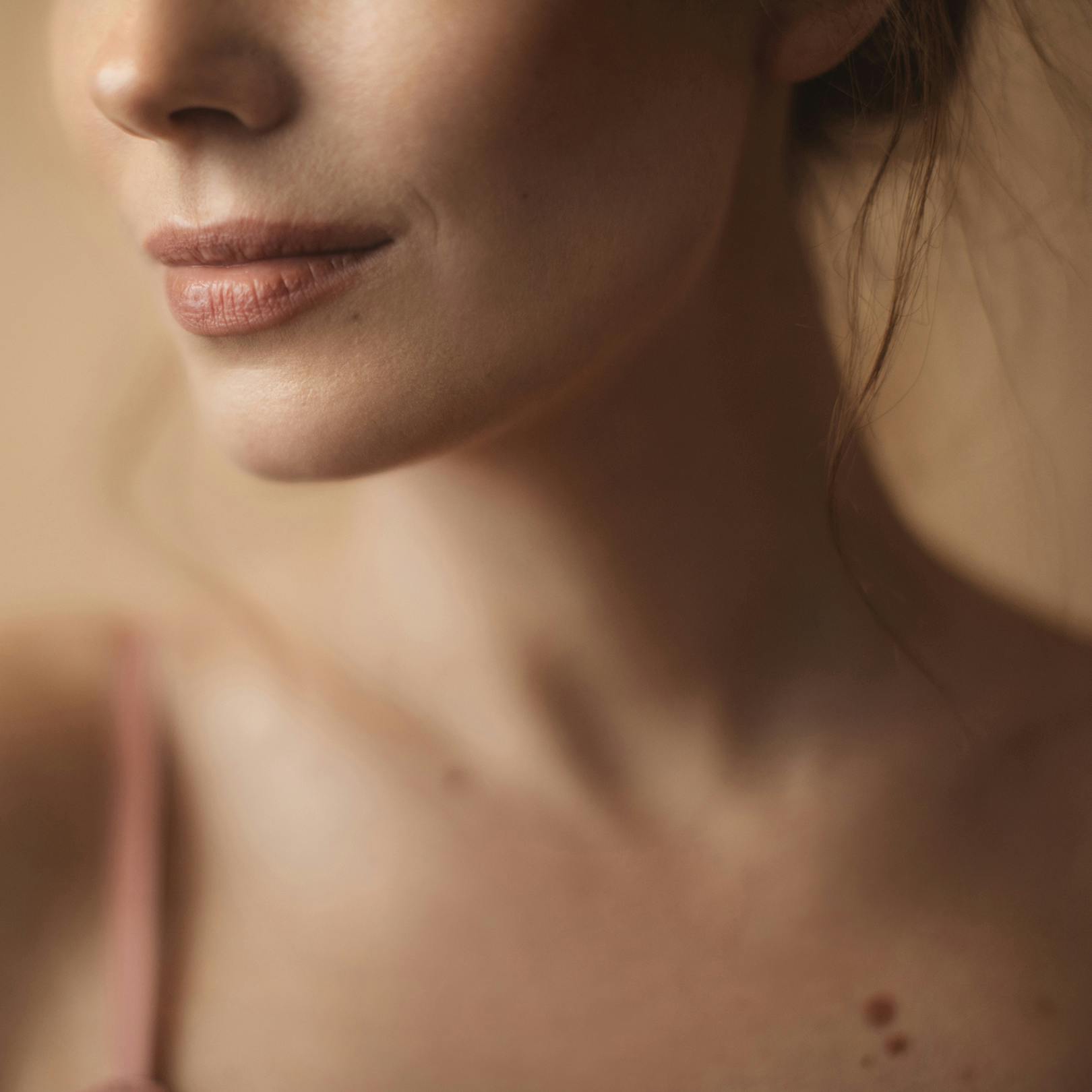 close up on a neck with moles