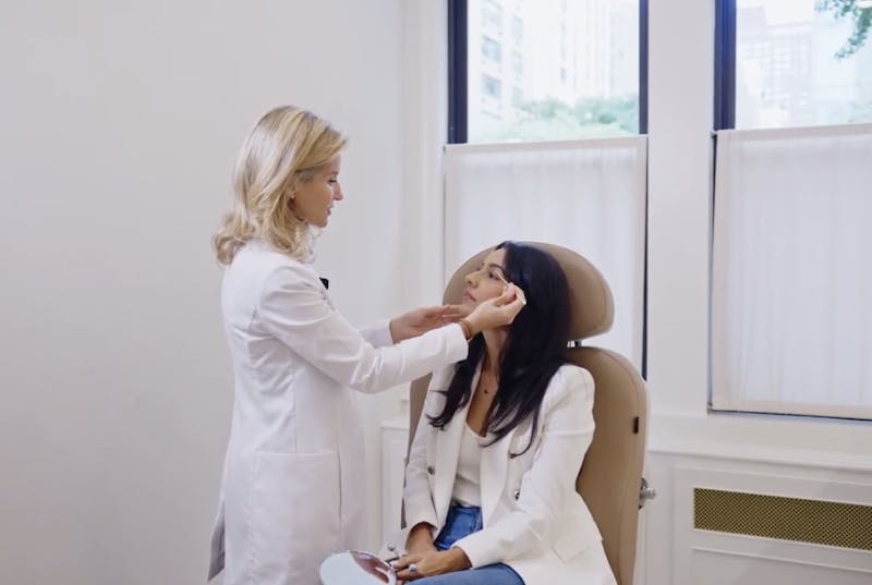 Dr. Klausner with a patient