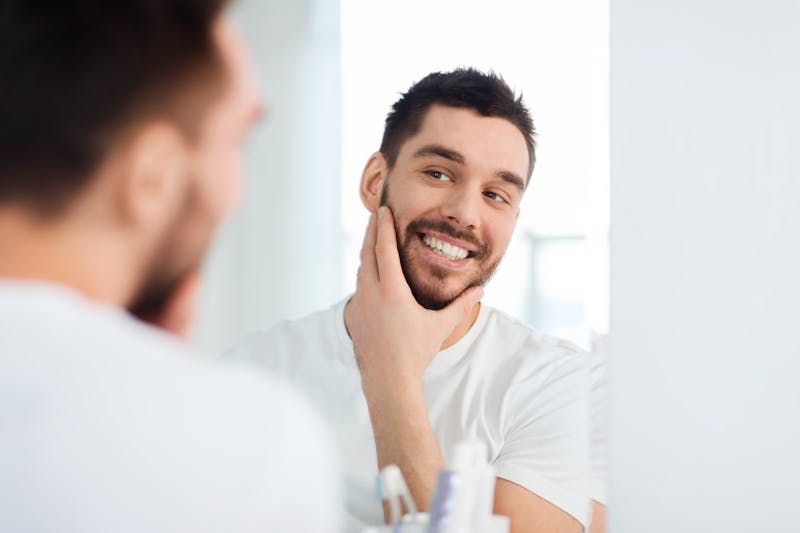 man seeing his refelction in the mirror