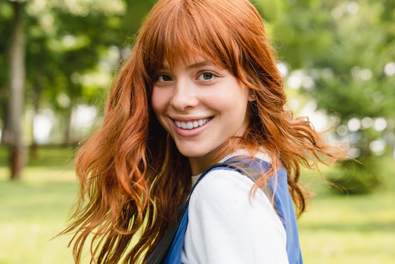 woman with red hair twirling