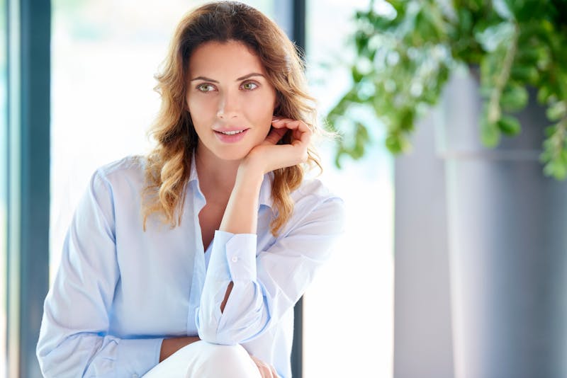woman in blue linen top