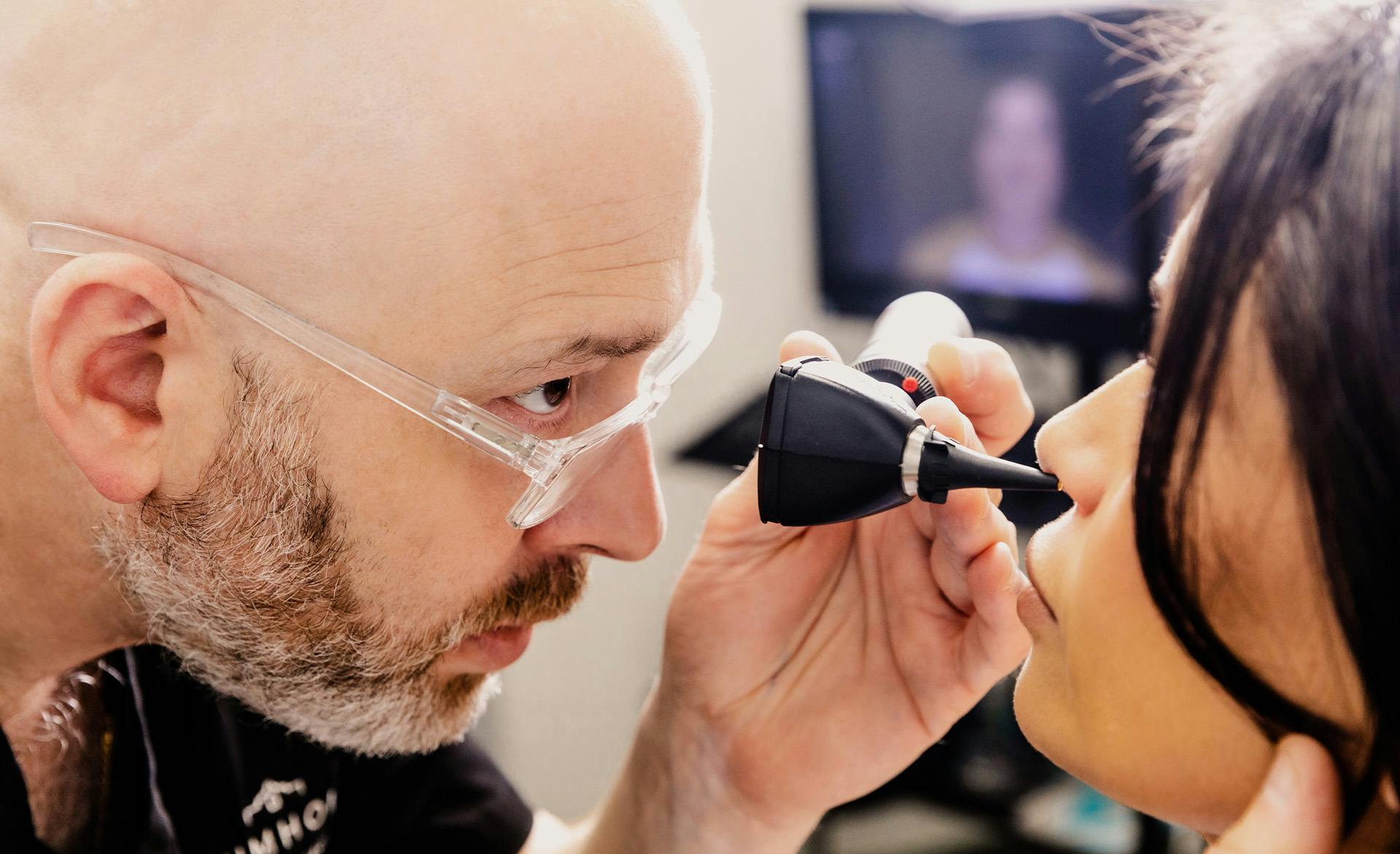 doctor checking nose