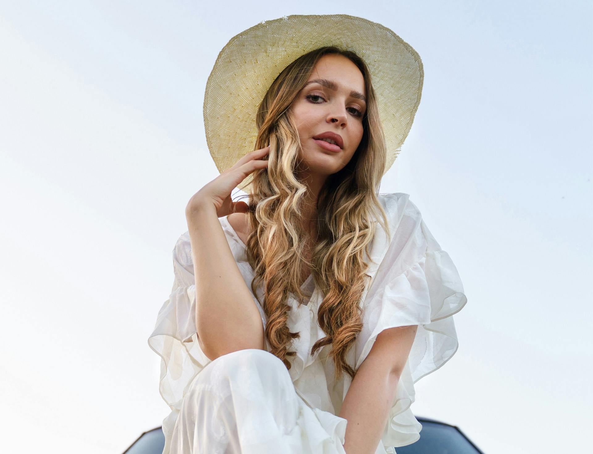 billowy dress with straw hat