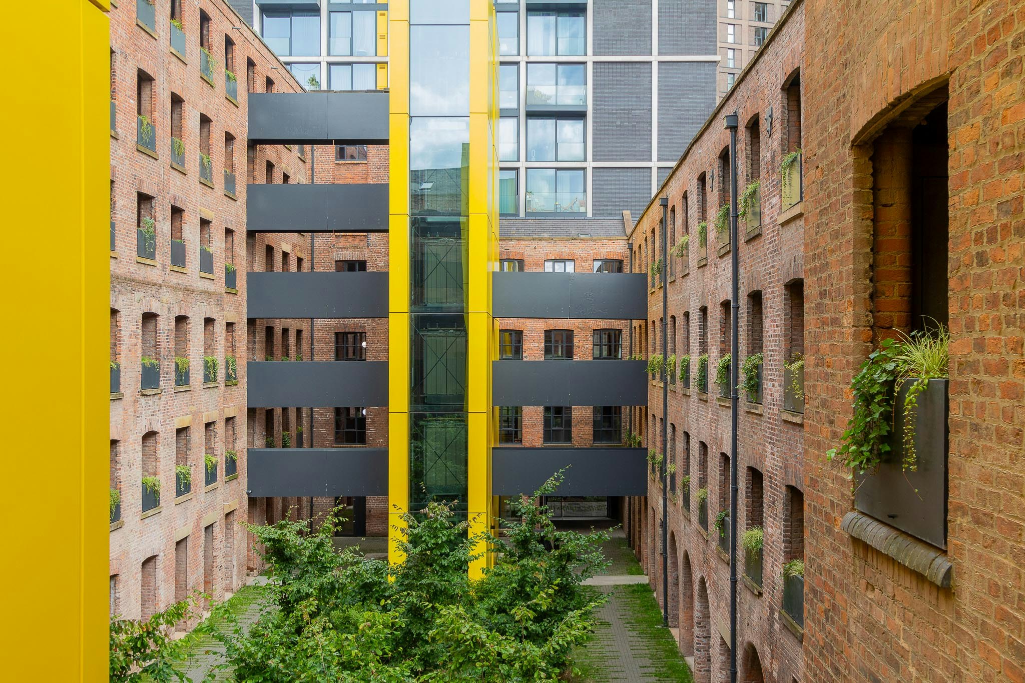 The bright yellow external cores allow the historic fabric to be left largely untouched.