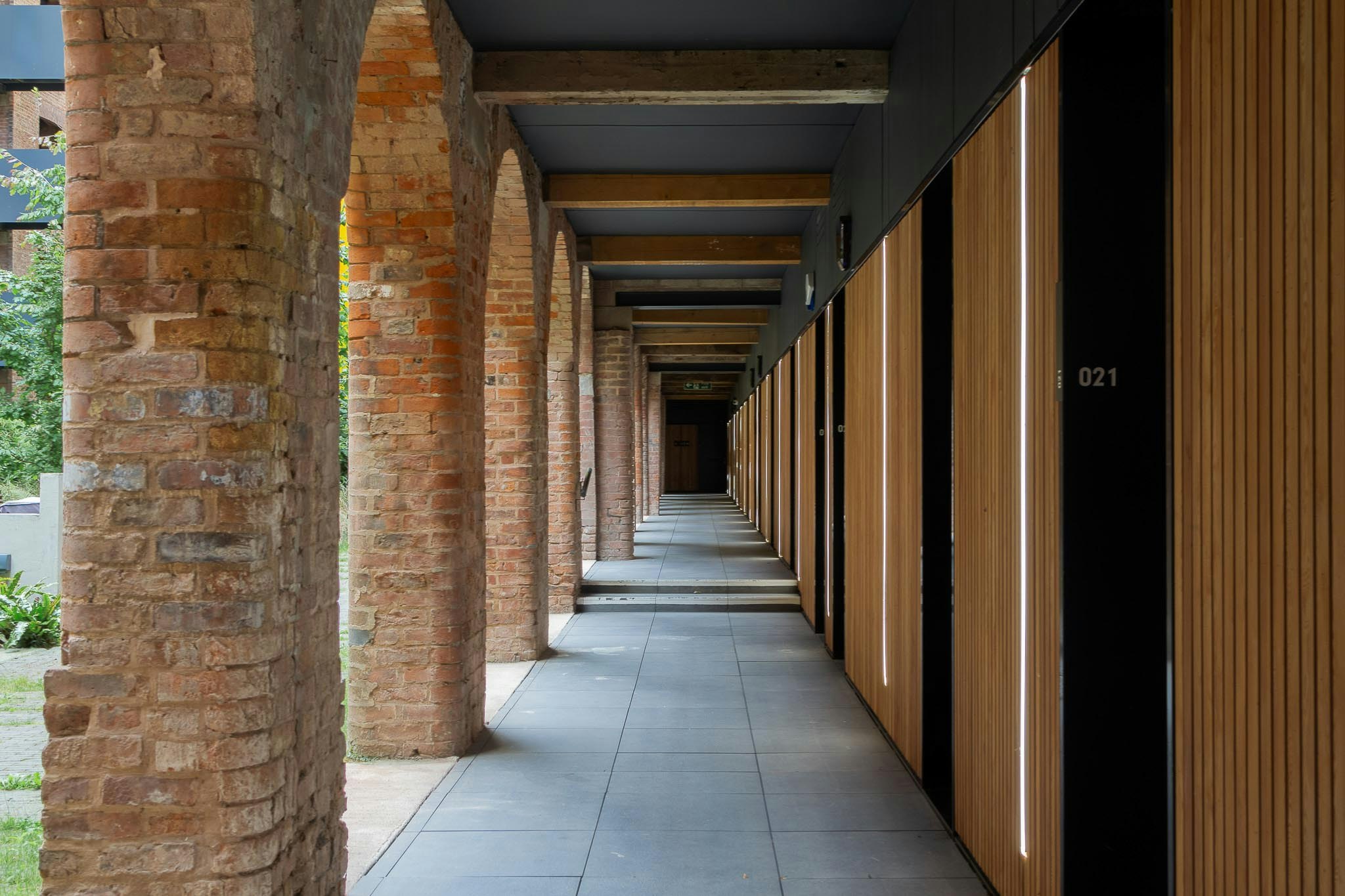 The cloistered walkways which link the apartment units with the landscaped communal garden.