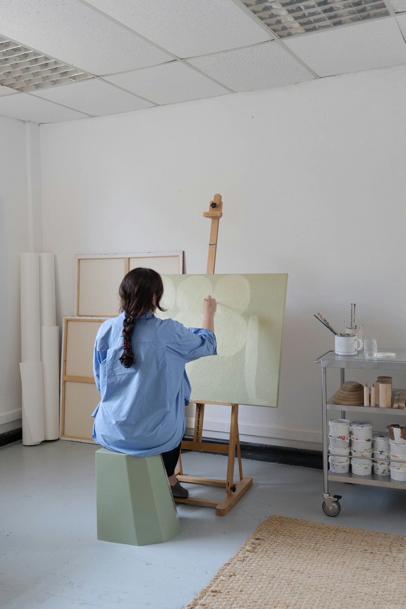 Laurie Maun's at work in her Stockport Art Studio, photographed by Ella Wheatley for Böhm, Design Led Estate Agent in Manchester.