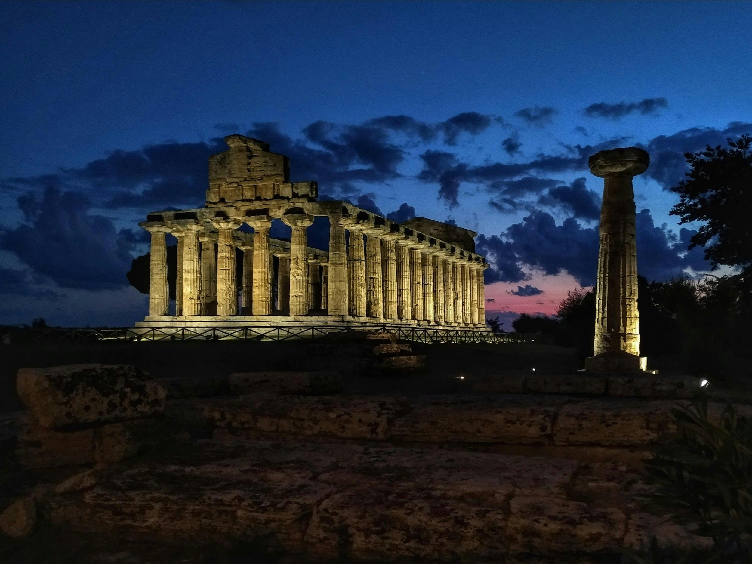 the ruins of the temple are lit up at night