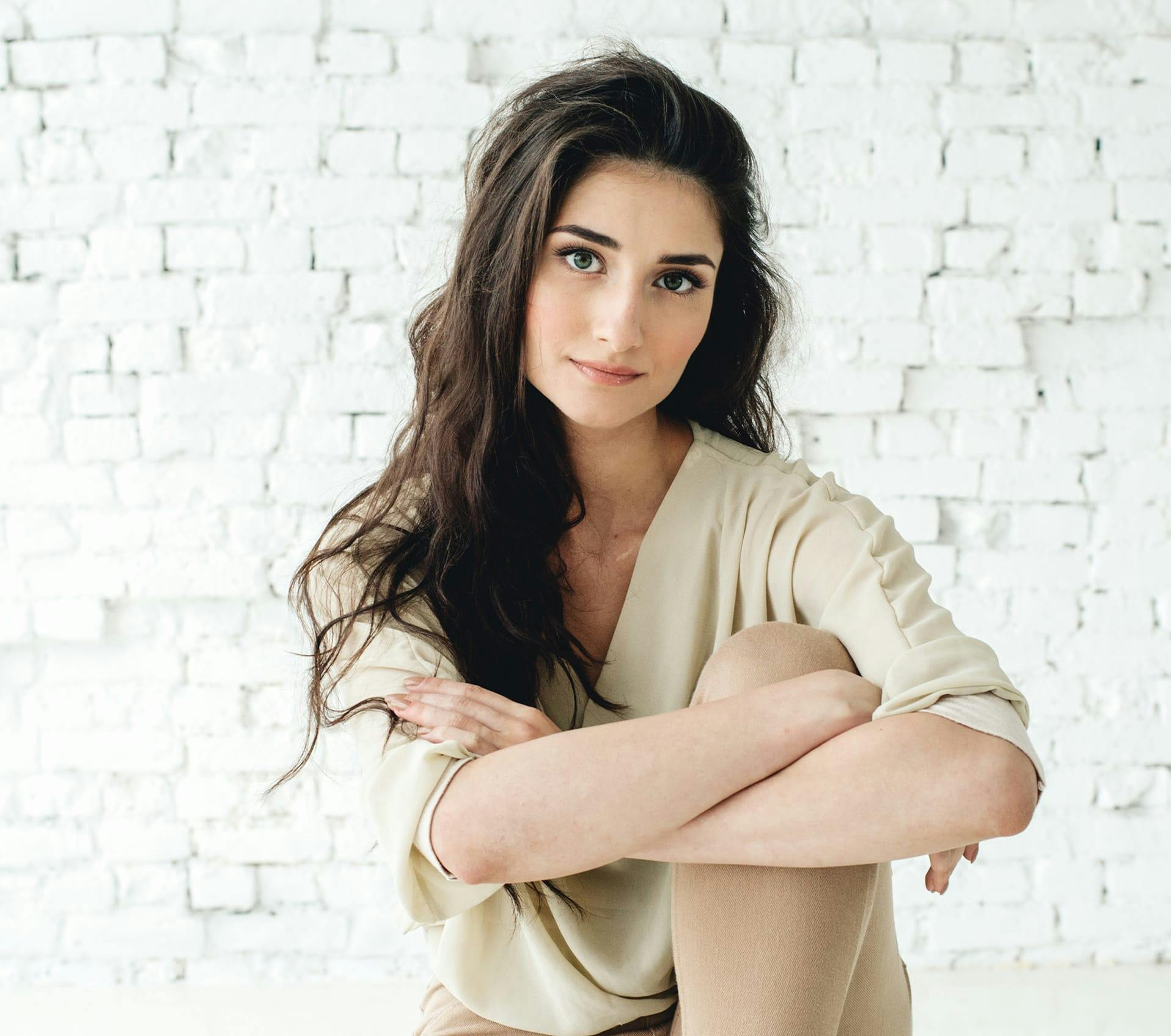 Woman sitting with her arms crossed