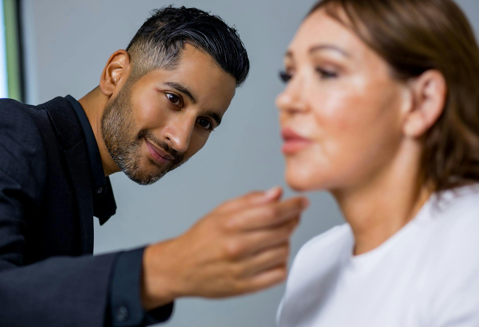 Dr. Tripathi looking at a patients face