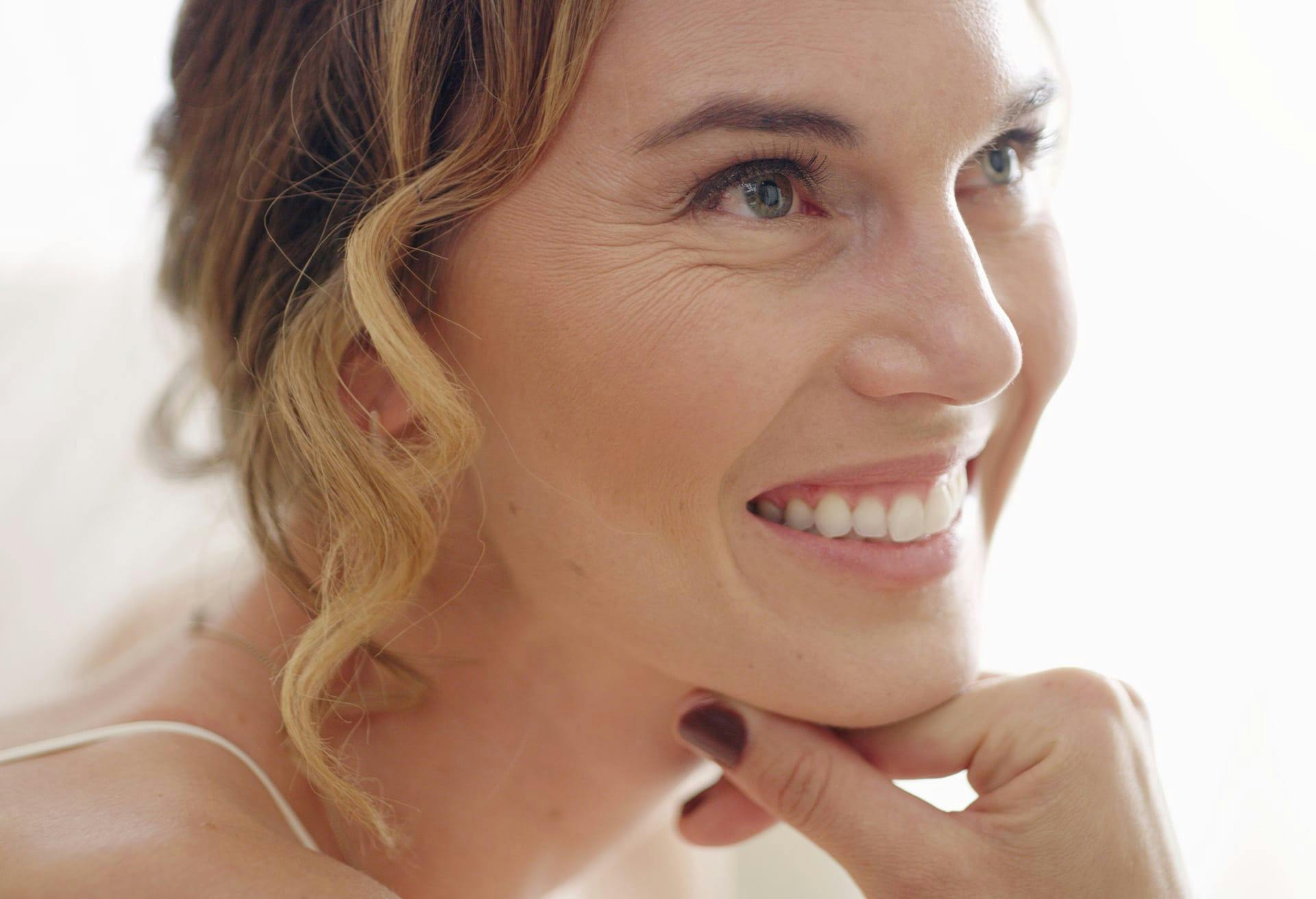 Woman with her hand on her chin