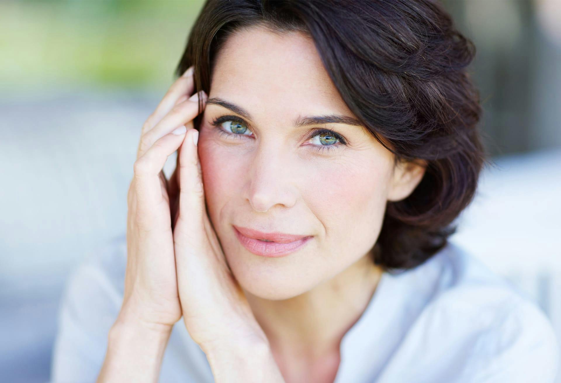 Woman with her hands on her cheek