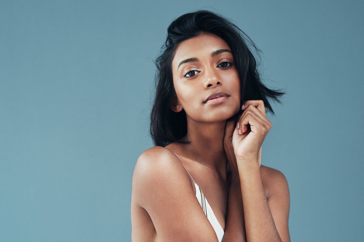 Woman with her hand on her face