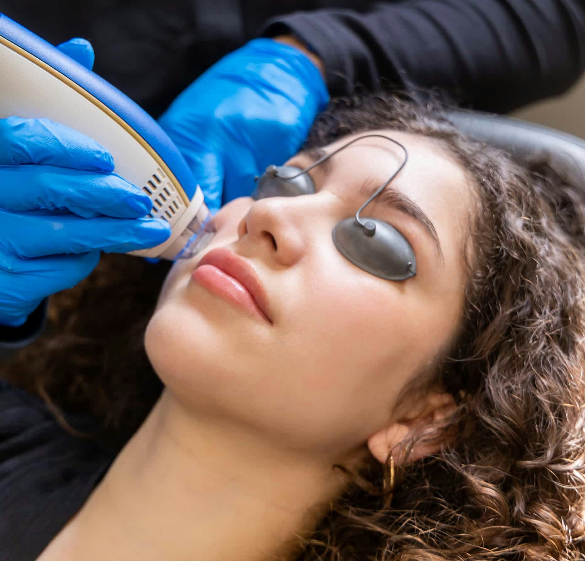 woman getting face treatment