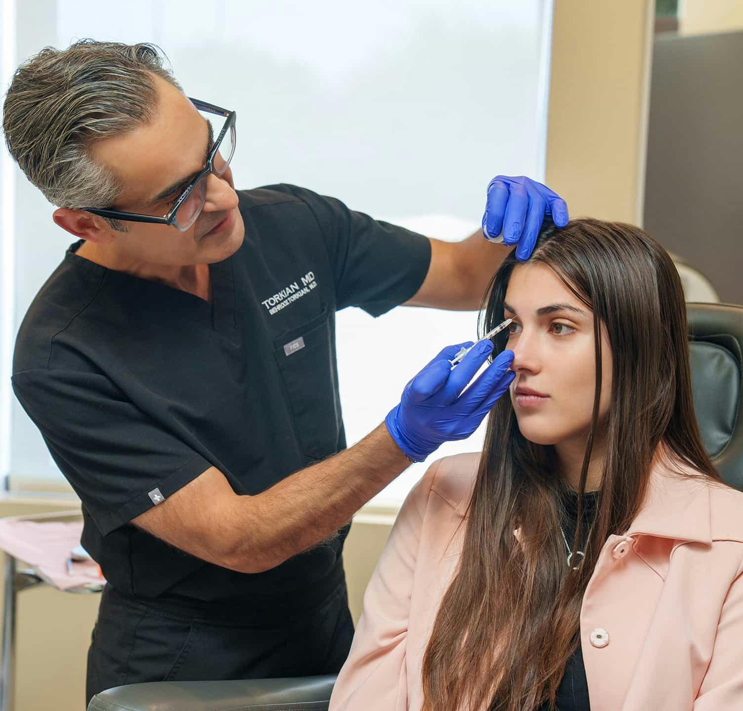 Woman receiving injectable treatment