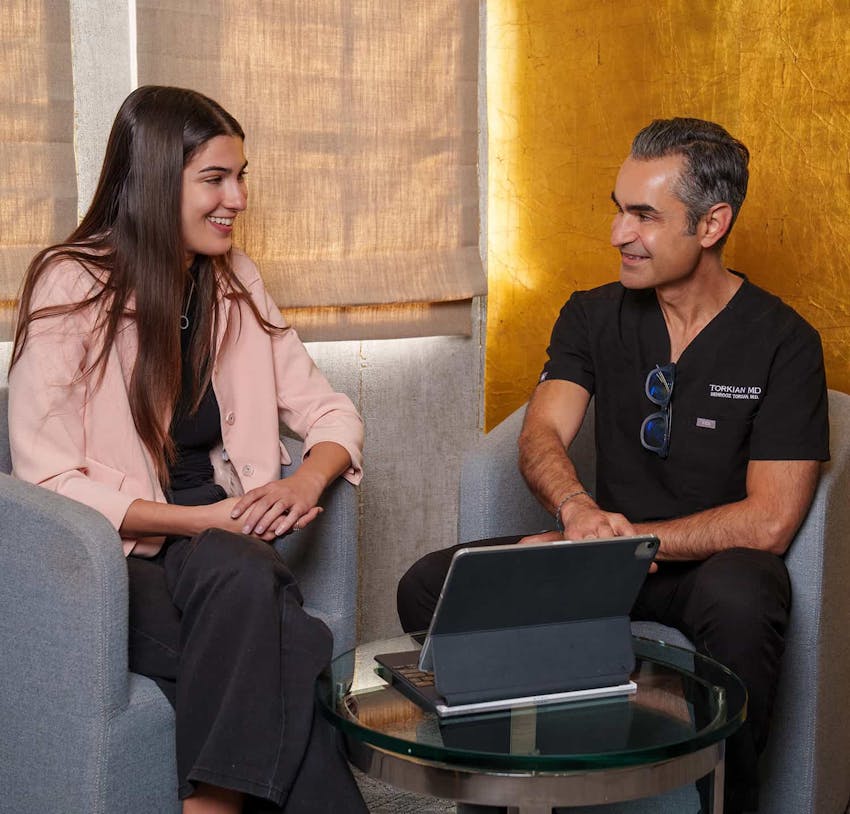 Dr. Torkian speaking to patient